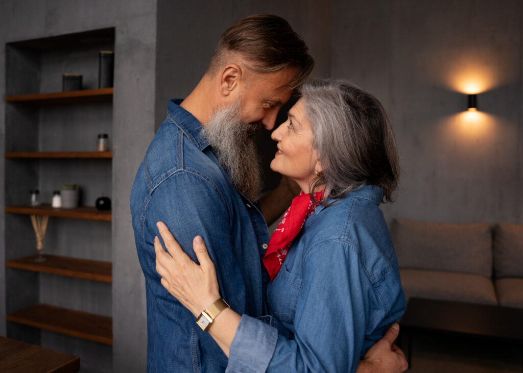 Elder couple laughing together, symbolizing intimacy and happiness